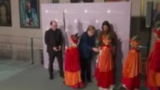 Germany's Merkel greets carol singers
