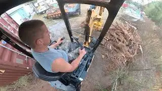 Clearing a scrap log pile along the property line pt.2