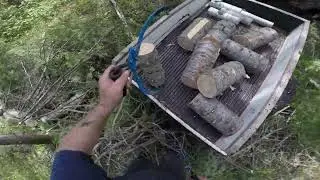 Tossing firewood with log tongs