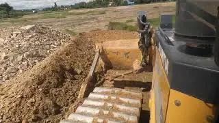 Skills operators bulldozer paving dirt and stone KHMER CONSTRUCTION