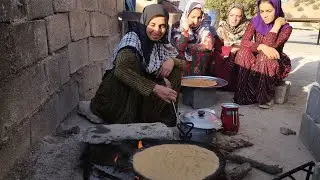 Preparing breakfast by a rural family: baking local bread (Barko) - rural life in Iran