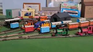 Bachmann Rusty pulling 4 Brown 3 grey slate wagons and red box van 
