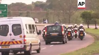 Body of Nelson Mandela leaves hospital for military airbase ahead of funeral