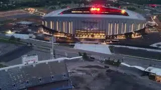 Highmark Buffalo Bills Stadium old & new at dusk.