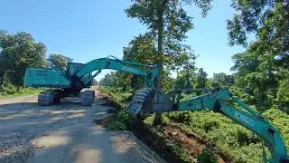 Kobelco 220 excavator working. Excavator slope cutting. Two  excavator competition. Railway  road