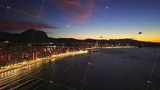Vibrant dusk with shimmering sea reflections, Nighttime urban landscape with mountain and ocean