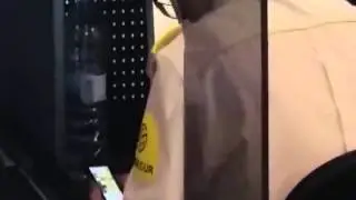Watch airport security worker 'too busy playing on his phone' to check passengers' baggage
