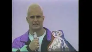 Chris Candido throws the US Junior Heavyweight title in a river