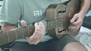 Sliding on a Copper Resonator Guitar 