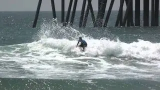 John John surfing around Orange County