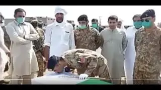 Lt Gen Sarfaraz Ali Shaheed kissing Major Nadeem Shaheed and national flag 8th May 2020