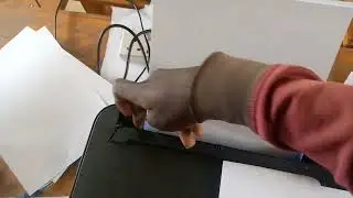 HOW TO  LOAD PAPER INTO A PRINTER.