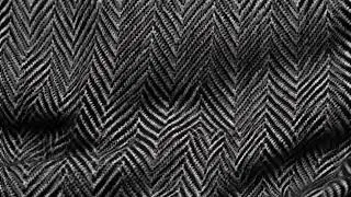herringbone black and white tweed textile texture background closeup of realistic tileable mottled