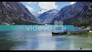 Llanganuco lake, boat and snow capped mountain huascaran, Ancash, Peru   UHD