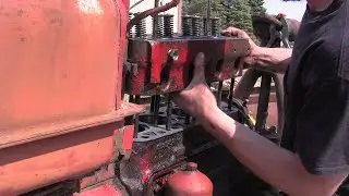 The head goes back onto the Farmall H