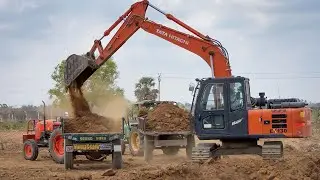 TATA EX130 Excavator Loading Mud in Kubota MU4501 and John Deere 5045 Tractor for Making New Pond