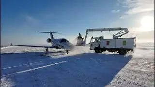 Private Jet Deicing on Snowy Runway at Sunrise