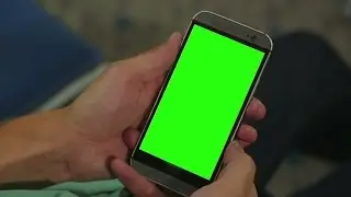 Closeup of male hands holding smart phone with green screen prekeyed for effects. Stock Footage