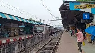 Down Sealdah EMU Red Silver local stopping at Sodepur station platform no. 2