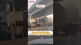Excavator hits bridge, slides off trailer and crashes onto highway #excavator-bridge-accident