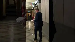 Scheer dodges reporters by pretending to take call