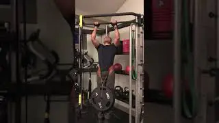 Celsius  does Pull-ups with 2 Plates