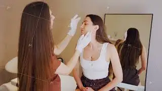 Gentle facial exam with esthetician caucasian woman in clinic chair, practitioner wearing gloves