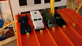Racing 4 of 5 vehicles from the Batman 5 pack from Hot Wheels down the Napation Speedway.