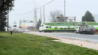 GO Transit Barrie Line passing the railroad crossing at Mulock Dr, Newmarket, ON