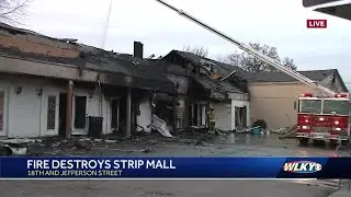 Small strip mall destroyed by fire in Russell neighborhood