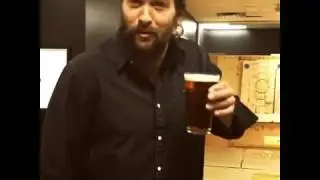 Jason Momoa throws an axe after sipping beer