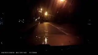 Road walkers in the rain in the middle of the night.