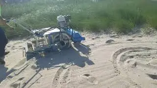 Beach Cleaner hydraulic drum drive removing plastics and debris from beach