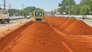 Bulldozer Leveling Red Soil for Major Road Construction,  Heavy Equipment Grading Urban Highway