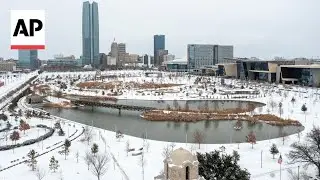 Aerial video shows a snow-covered Oklahoma City