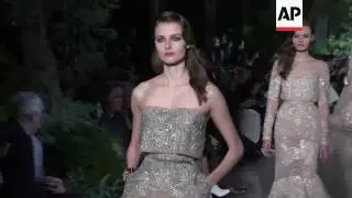 Lebanese designer Elie Saab shows a spring-summer 2015 collection inspired by Beirut in the 1960s
