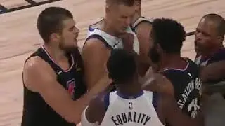 Kristaps Porzingis ejected after protecting Luka Doncic