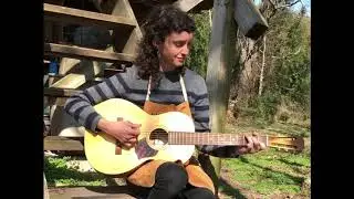 Preservation Guitar Company owner plays guitar she made at her shop near Fayetteville