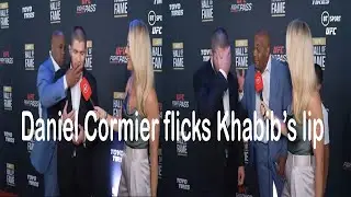 Daniel Cormier interrupts Khabib interview to flick his lip during UFC HALL OF FAME