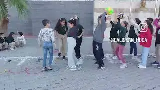 Eğitsel oyunlar. Top taşıma. Grupta en başa dönen kazanır. 
