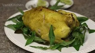 Gà hấp muối (Steamed chicken on a bed of rock salt)