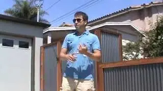 Wood Framed Corrugated Steel Perimeter Yard Fence with Matching Gates and Garbage Enclosure