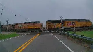 Southbound UP train with 44 freight cars in the rain north of Elkhart, Iowa on the Spine Line