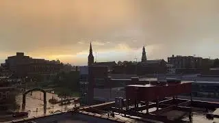 A rain shower over St. Joseph, Missouri as the sun sets