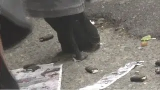 close up and slow motion of high heels crushing on the street