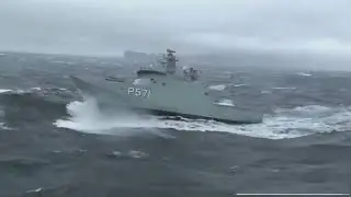 HDMS Ejnar Mikkelsen is cruising in difficult weather conditions.