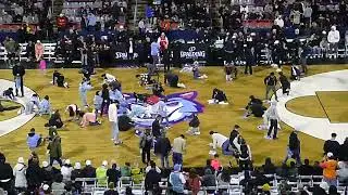 Lots of Montreal Alliance employees desperately try to make the court not slippery at IGA Stadium