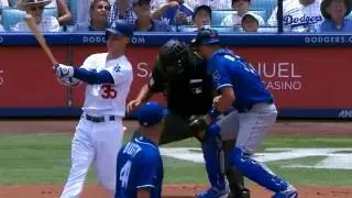 Umpire Kerwin Danley leaves after foul tip hits mask