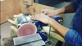 Sanding with ferm bench sander at daddy and Eliza