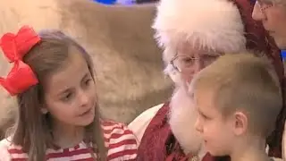 Soldier Surprises Kids Sitting on Santa's Lap